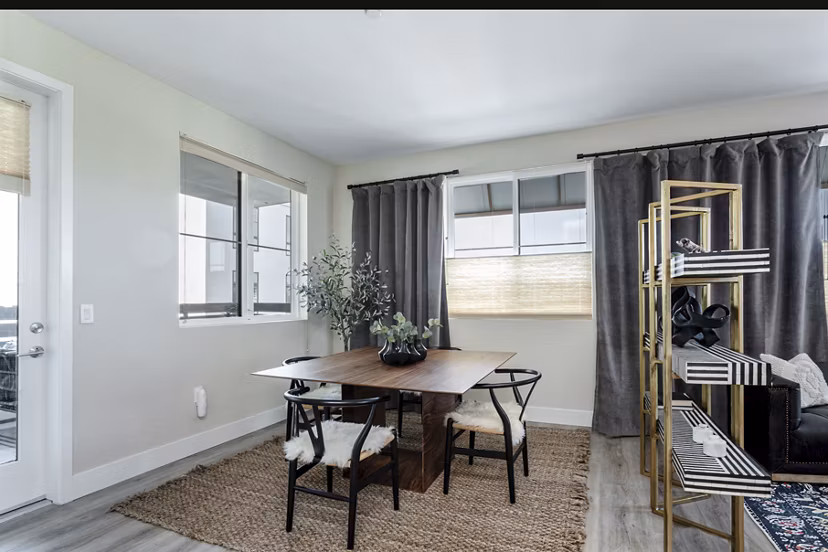 Dining room featuring elegant furnishings and modern lighting at Prado West Apartments