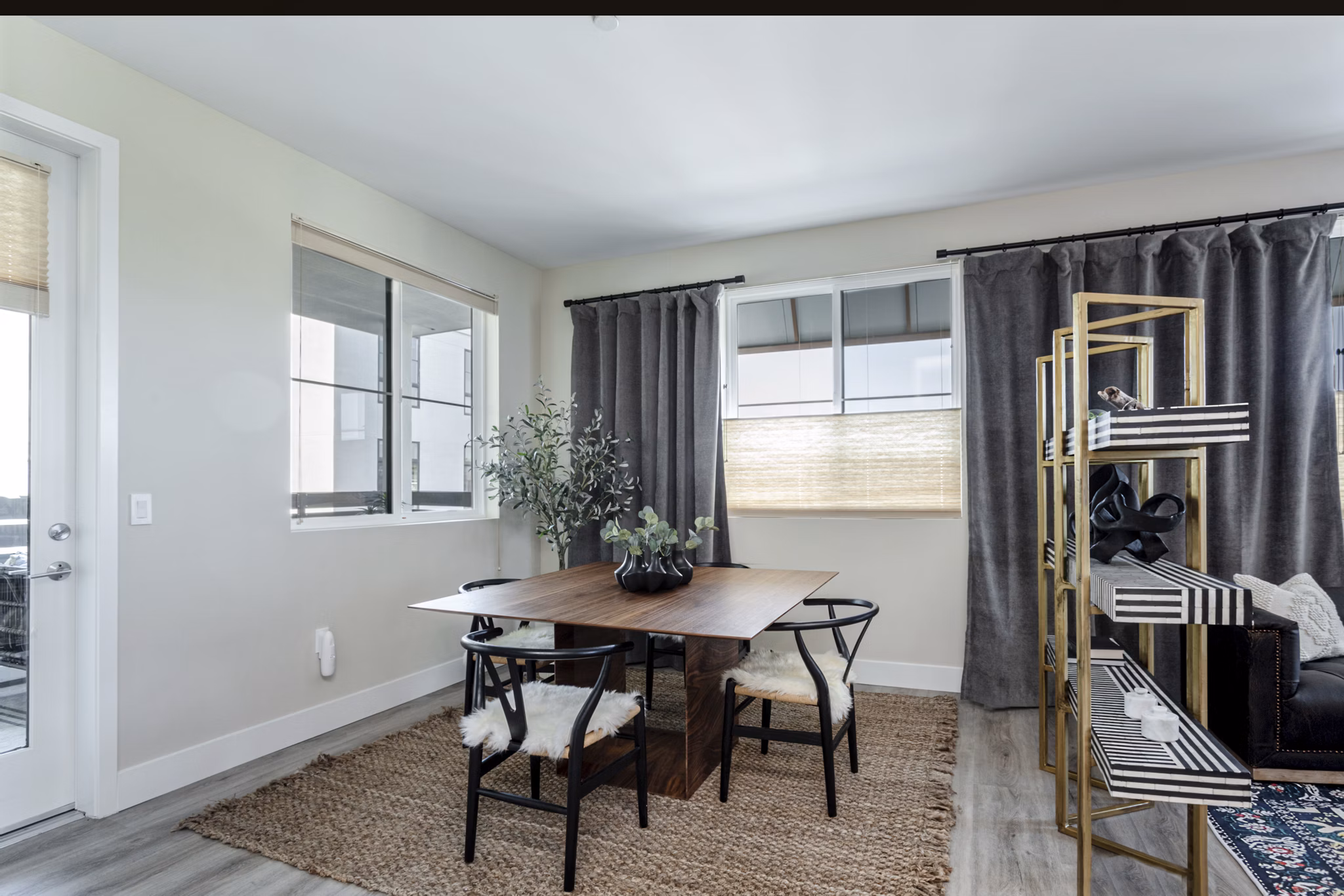 Dining room featuring elegant furnishings and modern lighting at Prado West Apartments