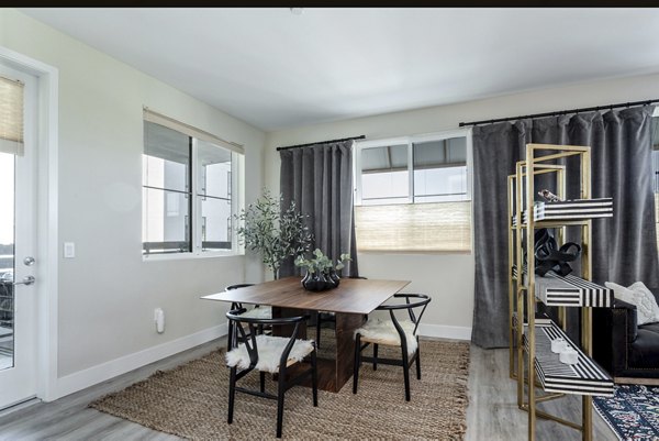 Dining room featuring elegant furnishings and modern lighting at Prado West Apartments