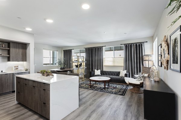 Modern kitchen with sleek countertops and stainless steel appliances at Prado West Apartments