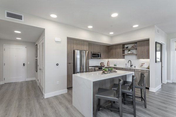 Modern kitchen with stainless steel appliances at Prado West Apartments