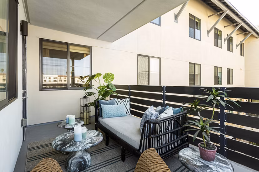 Elegant balcony with cityscape views at Prado West Apartments
