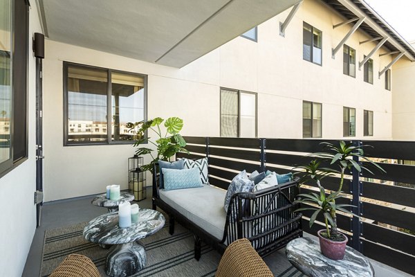 Elegant balcony with cityscape views at Prado West Apartments