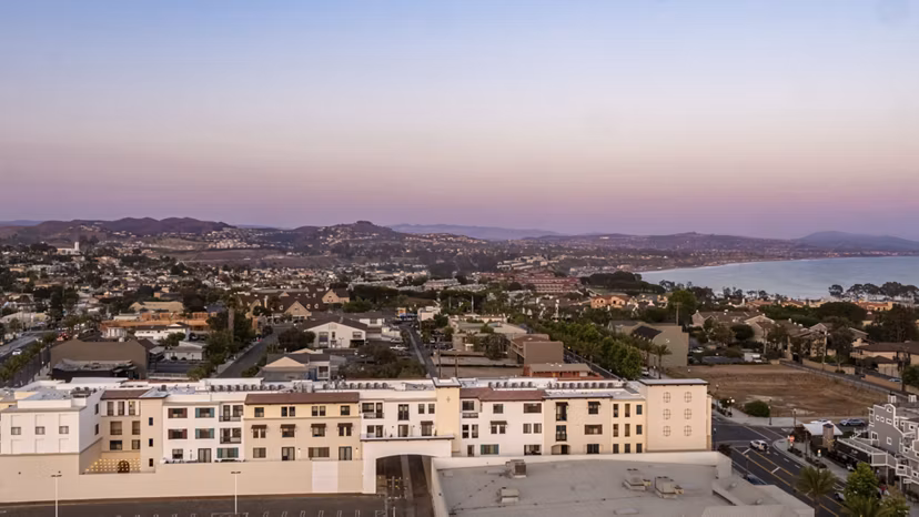 Elegant city view from rooftop terrace at Prado West Apartments