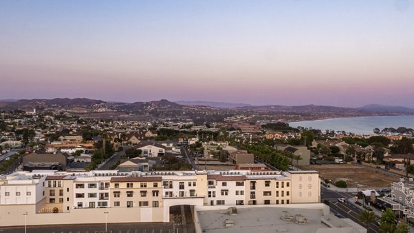 Elegant city view from rooftop terrace at Prado West Apartments