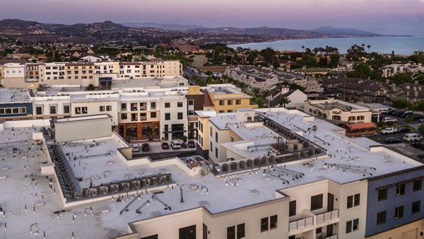 Skyline view from rooftop at Prado West Apartments: Luxury high-rise living with stunning cityscape views