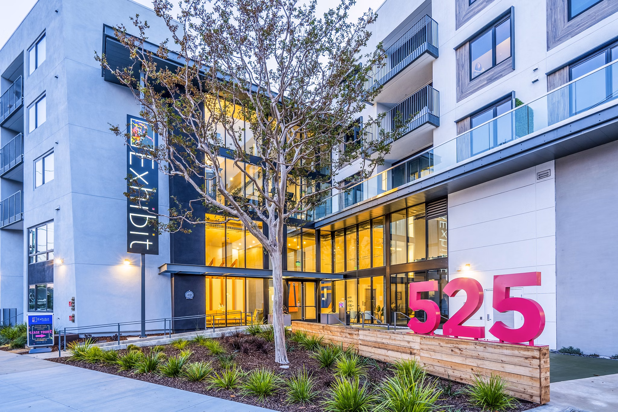 Exhibit at J Town: Modern with distinctive signage at luxury apartments in vibrant urban setting