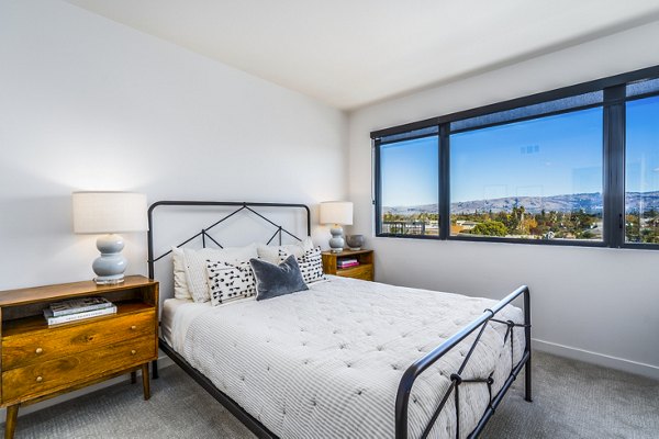 Spacious bedroom with stylish decor at Exhibit at J Town Apartments