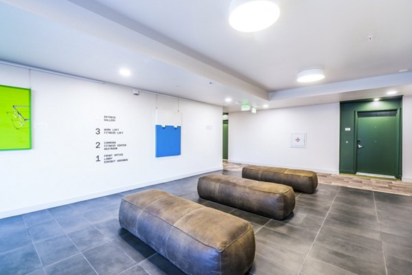 Exhibit at J Town Apartments: Modern clubhouse with cozy seating in a vibrant community