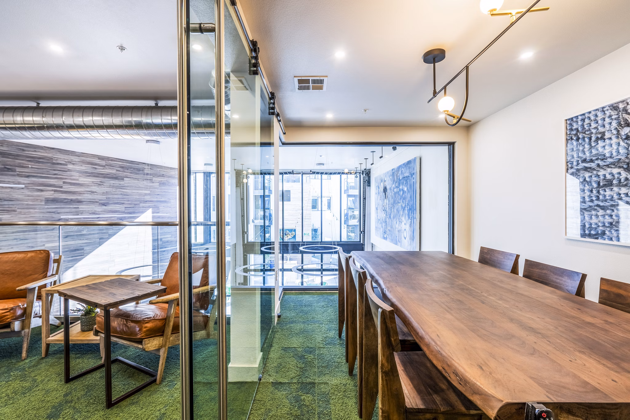 Clubhouse meeting facility with modern design at Exhibit at J Town Apartments