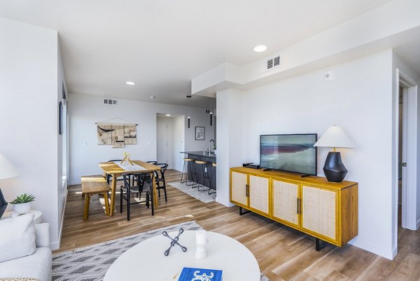 Dining room with modern decor and stylish lighting at Exhibit at J Town Apartments