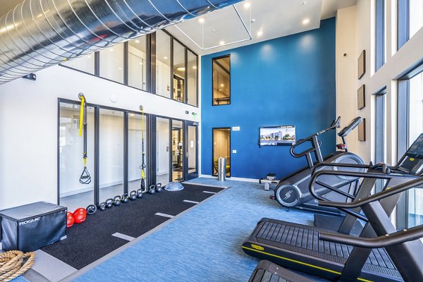 State-of-the-art fitness center with modern equipment at Exhibit at J Town Apartments