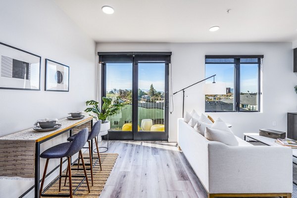 Stylish living room with modern furnishings at Exhibit at J Town Apartments