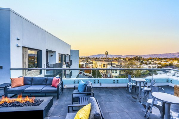 Scenic city views from a furnished patio at Exhibit at J Town Apartments