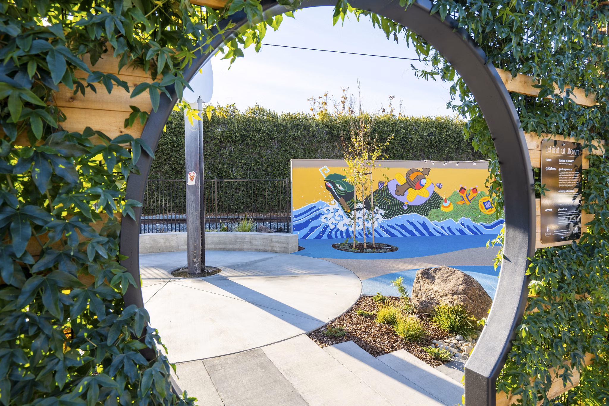 Spacious courtyard with modern landscaping at Exhibit at J Town Apartments, offering a tranquil retreat within the luxury apartment community