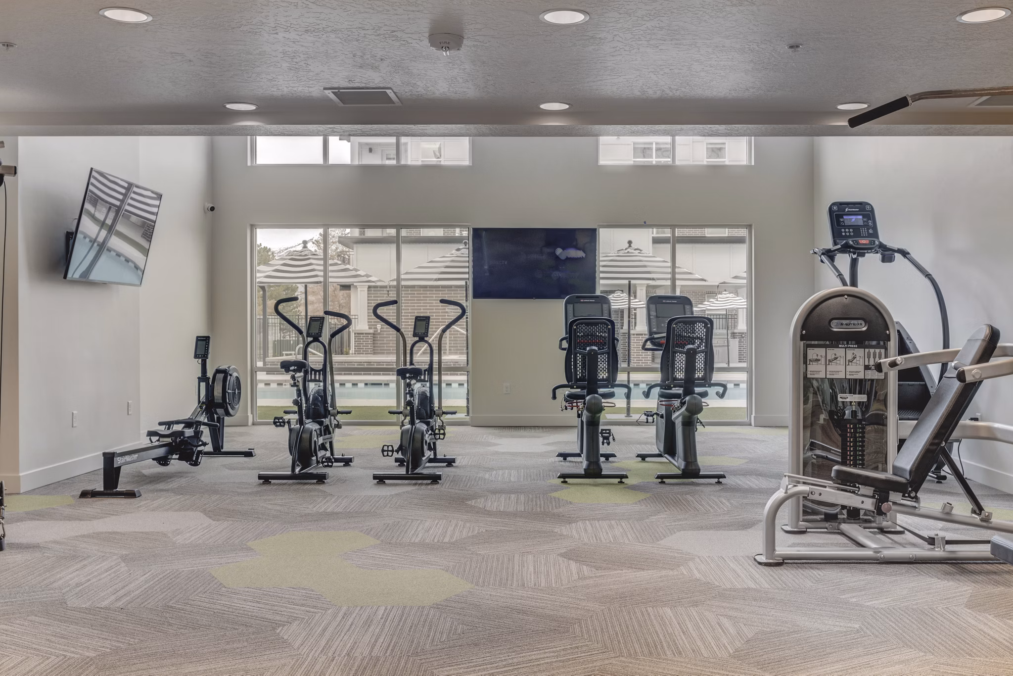 State-of-the-art fitness center with modern equipment at Harmony3900 Apartments, perfect for active residents seeking a healthy lifestyle
