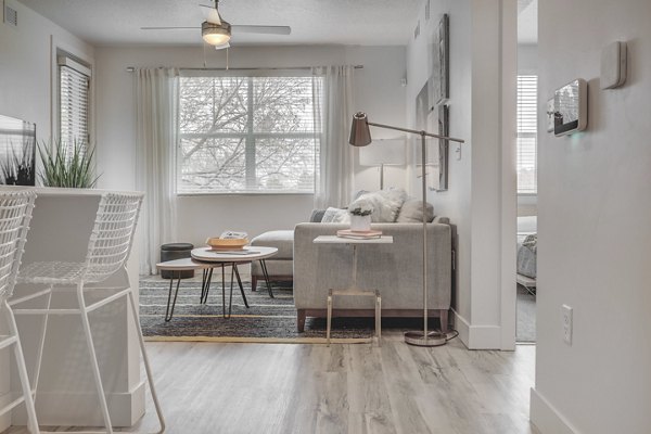 Spacious living room with modern decor in Harmony3900 Apartments, luxury rental apartments