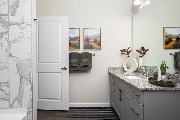 Luxurious bathroom with modern fixtures at Bellrock Memorial Apartments