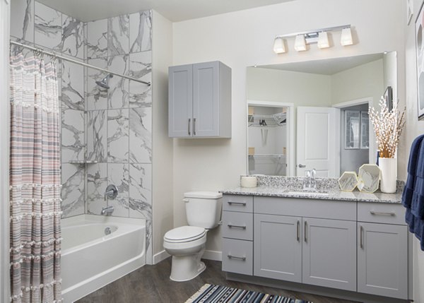 Luxurious bathroom with marble countertops at Bellrock Memorial Apartments