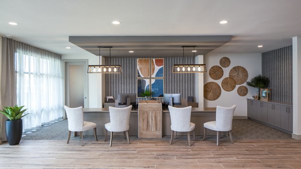 Clubhouse featuring modern design and leasing office at Bellrock Memorial Apartments