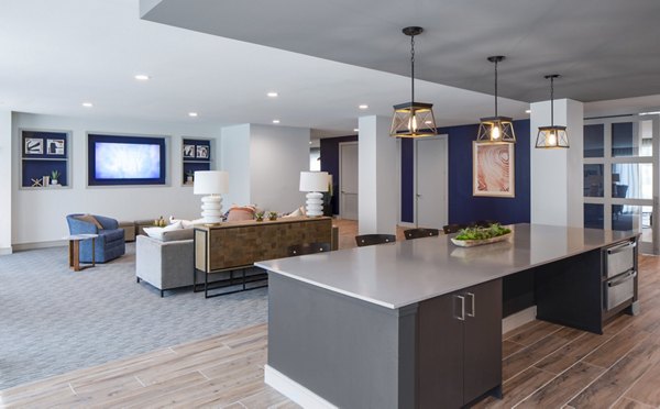 Bellrock Memorial Apartments: Chic clubhouse with modern furnishings and vibrant decor ideal for social gatherings and events