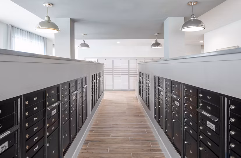 Clubhouse mail room with modern parcel lockers at Bellrock Memorial Apartments