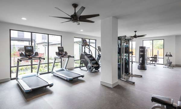 State-of-the-art fitness center with modern equipment at Bellrock Memorial Apartments