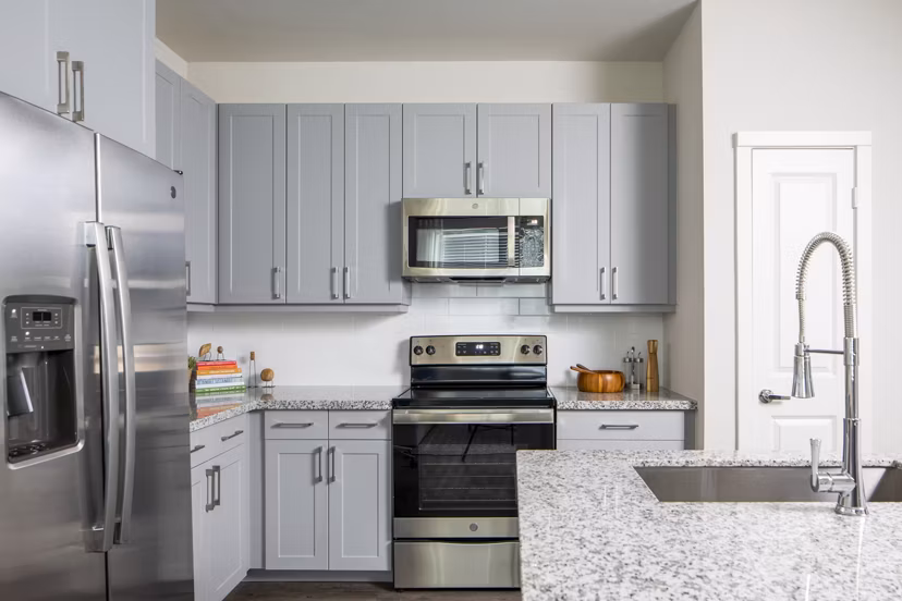 Modern kitchen with stainless steel appliances at Bellrock Memorial Apartments