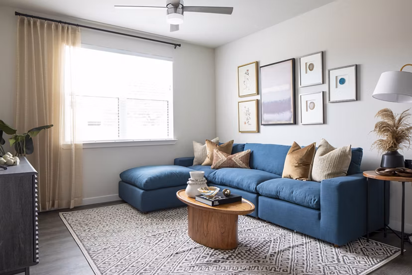 Living room with modern decor and natural light at Bellrock Memorial Apartments