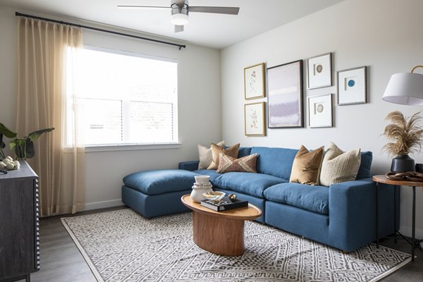 Living room with modern decor and natural light at Bellrock Memorial Apartments