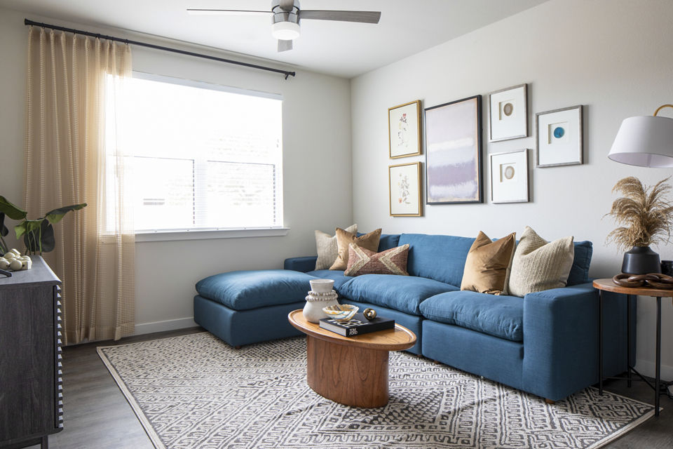 Living room with modern decor and natural light at Bellrock Memorial Apartments