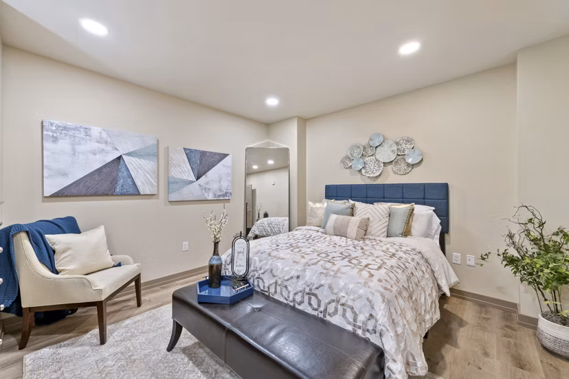 Bedroom featuring modern furniture and neutral tones at City Creek Landing Apartments