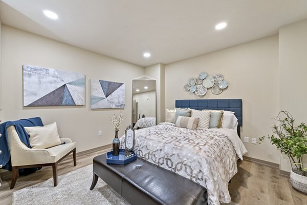 Bedroom featuring modern furniture and neutral tones at City Creek Landing Apartments