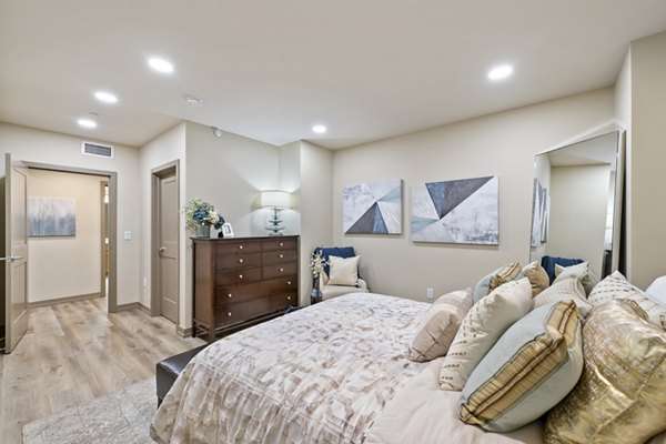 Modern bedroom with city views at City Creek Landing Apartments