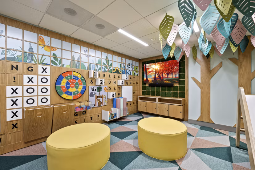 Modern clubhouse with cozy seating at City Creek Landing Apartments