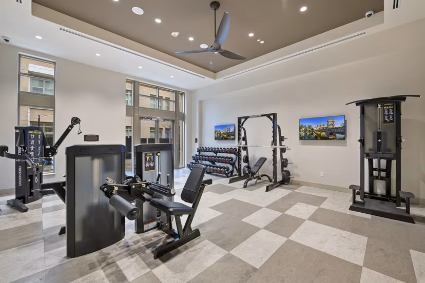 State-of-the-art fitness center with equipment at City Creek Landing Apartments