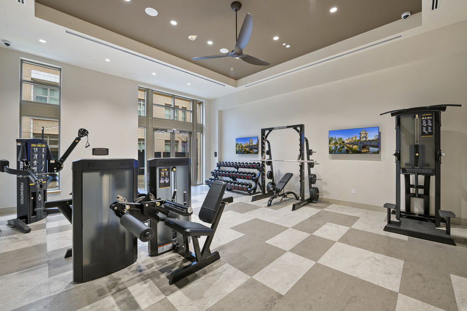 State-of-the-art fitness center with equipment at City Creek Landing Apartments