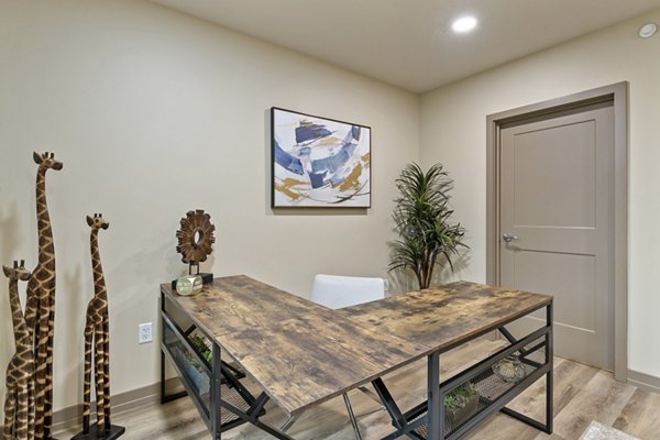 Bright home office with modern furnishings at City Creek Landing Apartments