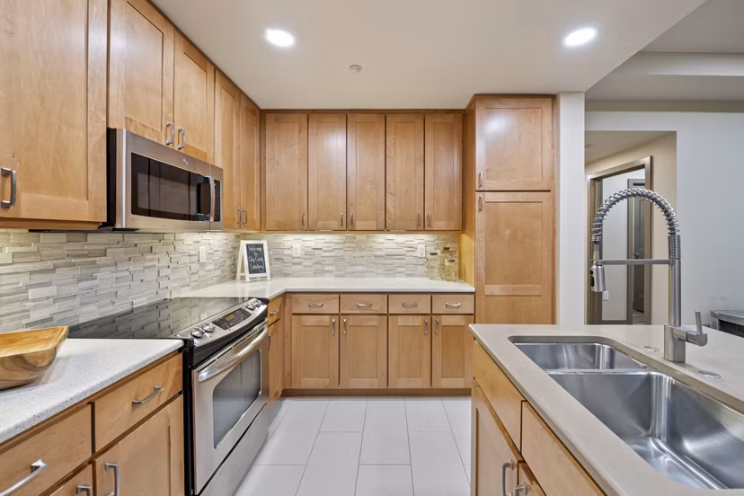 Modern kitchen with stainless steel appliances at City Creek Landing Apartments in Salt Lake City