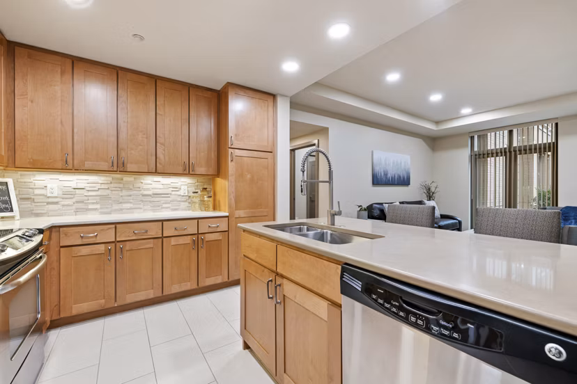 Modern kitchen with stainless steel appliances at City Creek Landing Apartments
