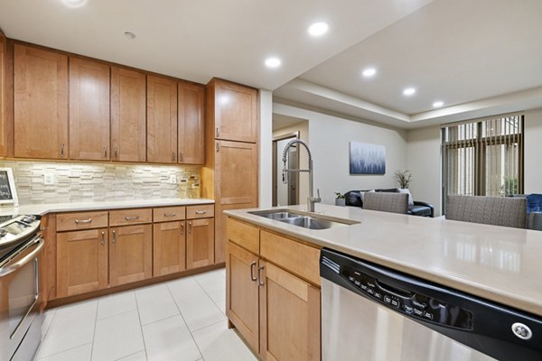 Modern kitchen with stainless steel appliances at City Creek Landing Apartments