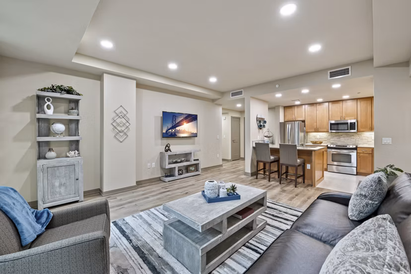Elegant living room with modern furnishings at City Creek Landing Apartments, featuring spacious layout and stylish decor for luxury urban living