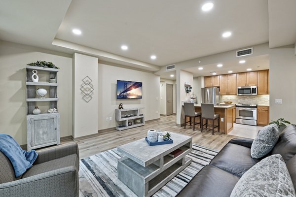 Elegant living room with modern furnishings at City Creek Landing Apartments, featuring spacious layout and stylish decor for luxury urban living