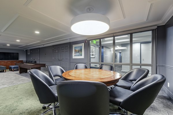 Meeting room with modern design and sleek furniture at Brigham Apartments, ideal for gatherings and team events