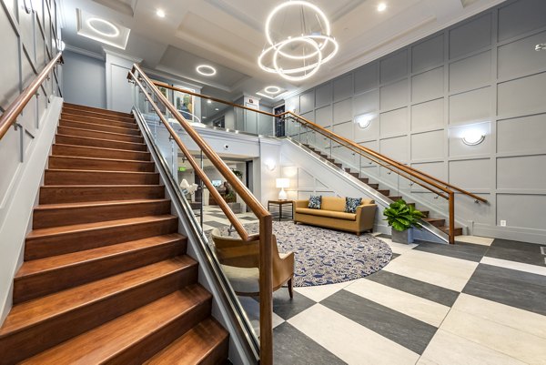 Clubhouse featuring modern design and communal seating at Brigham Apartments, a luxury living community by Greystar