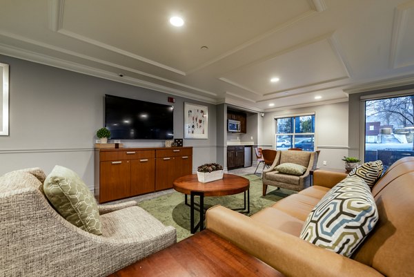 Clubhouse featuring modern design and communal seating at Brigham Apartments, offering luxury living spaces for residents