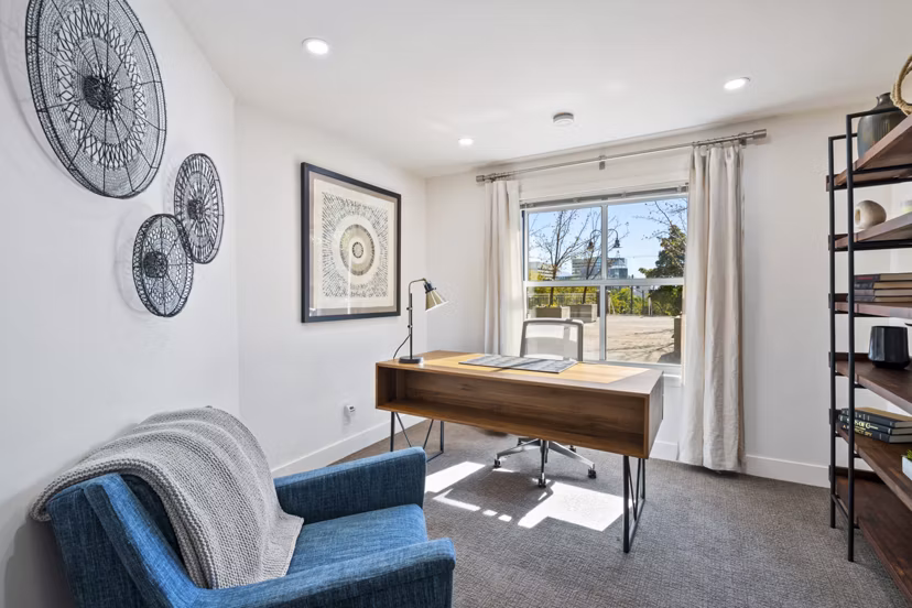 Bright living room with modern furnishings at Brigham Apartments, luxury spaces perfect for comfortable urban living