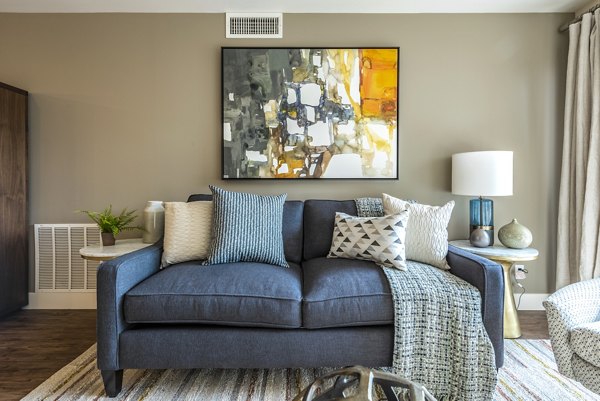 Bright living room with modern furnishings at Brigham Apartments, luxury spaces perfect for comfortable urban living