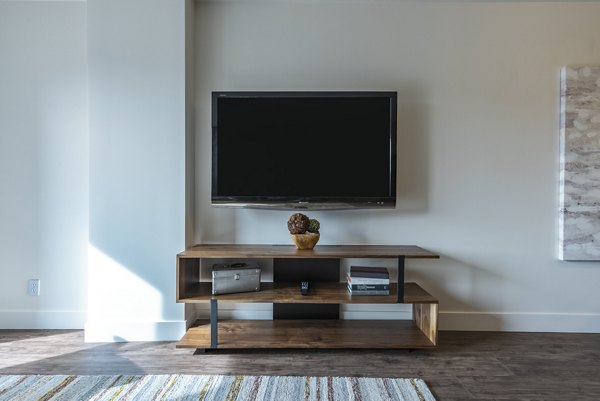 Spacious living room with contemporary decor in Brigham Apartments
