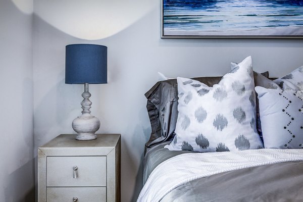 Spacious bedroom with modern decor at Colonial Court Apartments
